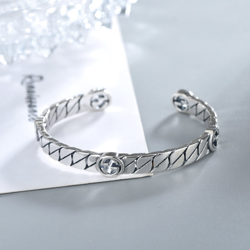 GUCCI SILVER INTERLOCKING OPEN BRACELET