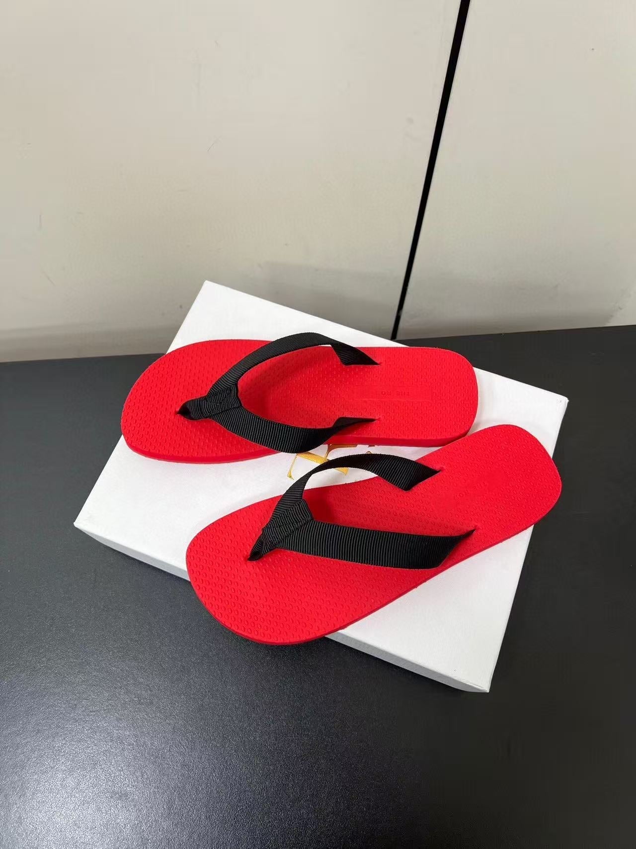 PRADA THE ROW THICK-SOLED FLIP FLOPS IN RED RUBBER