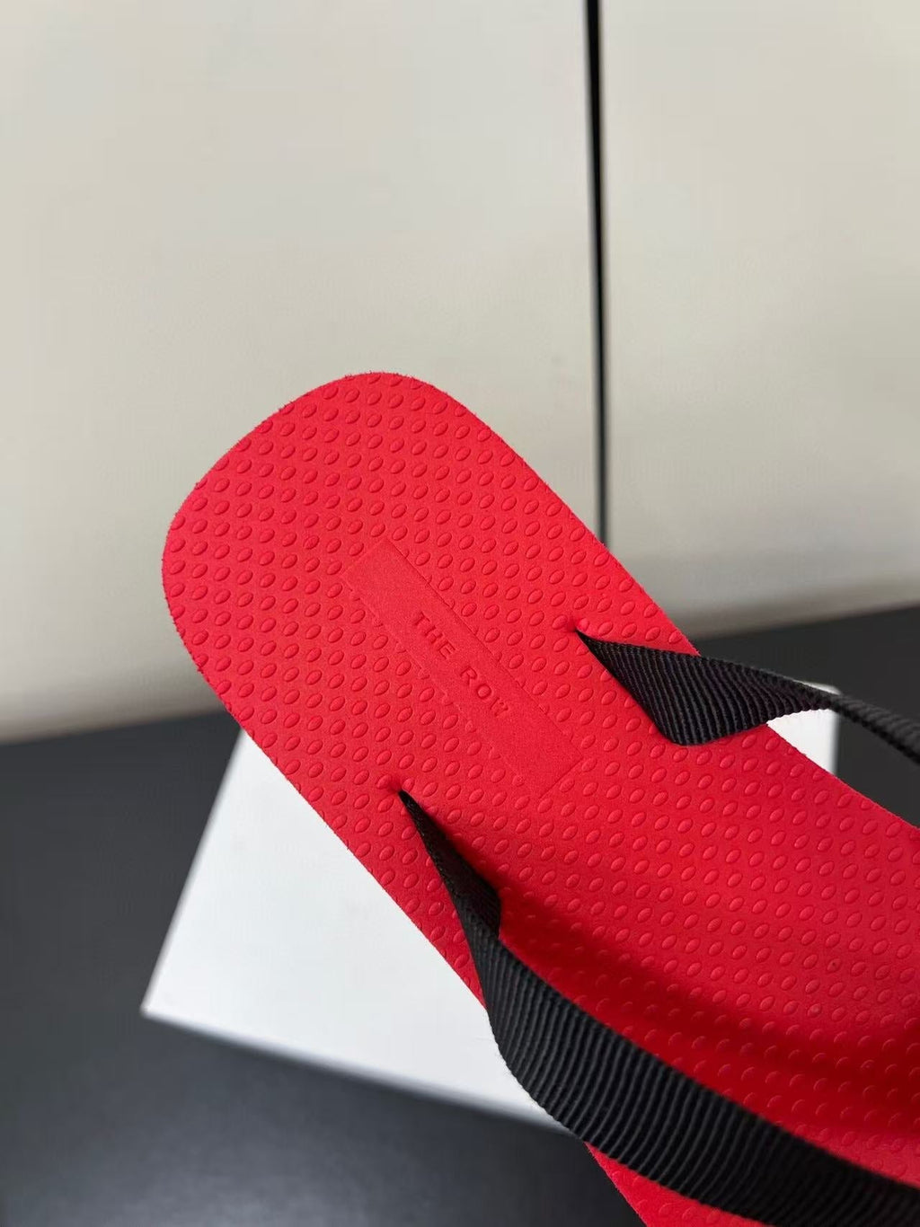 PRADA THE ROW THICK-SOLED FLIP FLOPS IN RED RUBBER