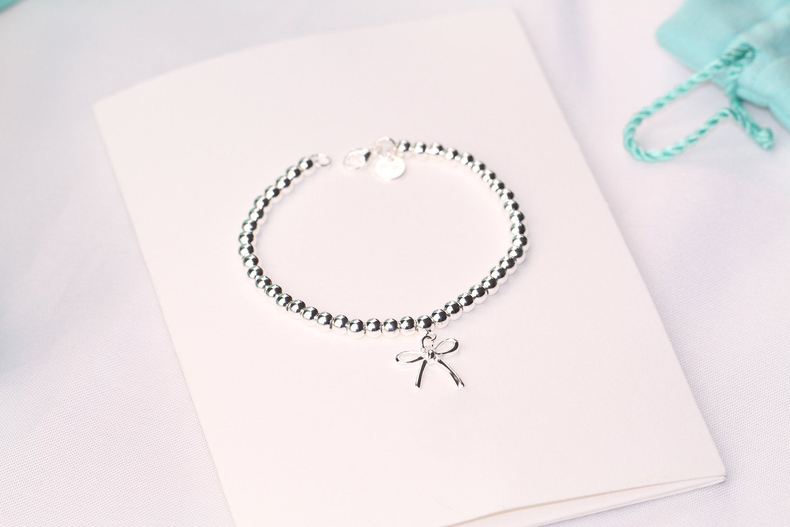 TIFFANY STERLING SILVER BOW BEAD BRACELET