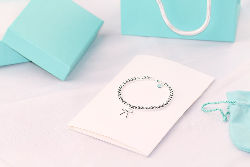 TIFFANY STERLING SILVER BOW BEAD BRACELET