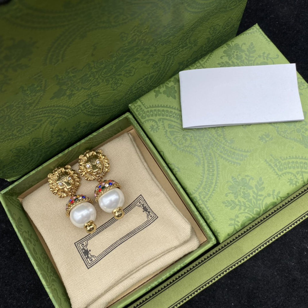 GUCCI LION HEAD PEARL COLORED DIAMOND EARRINGS