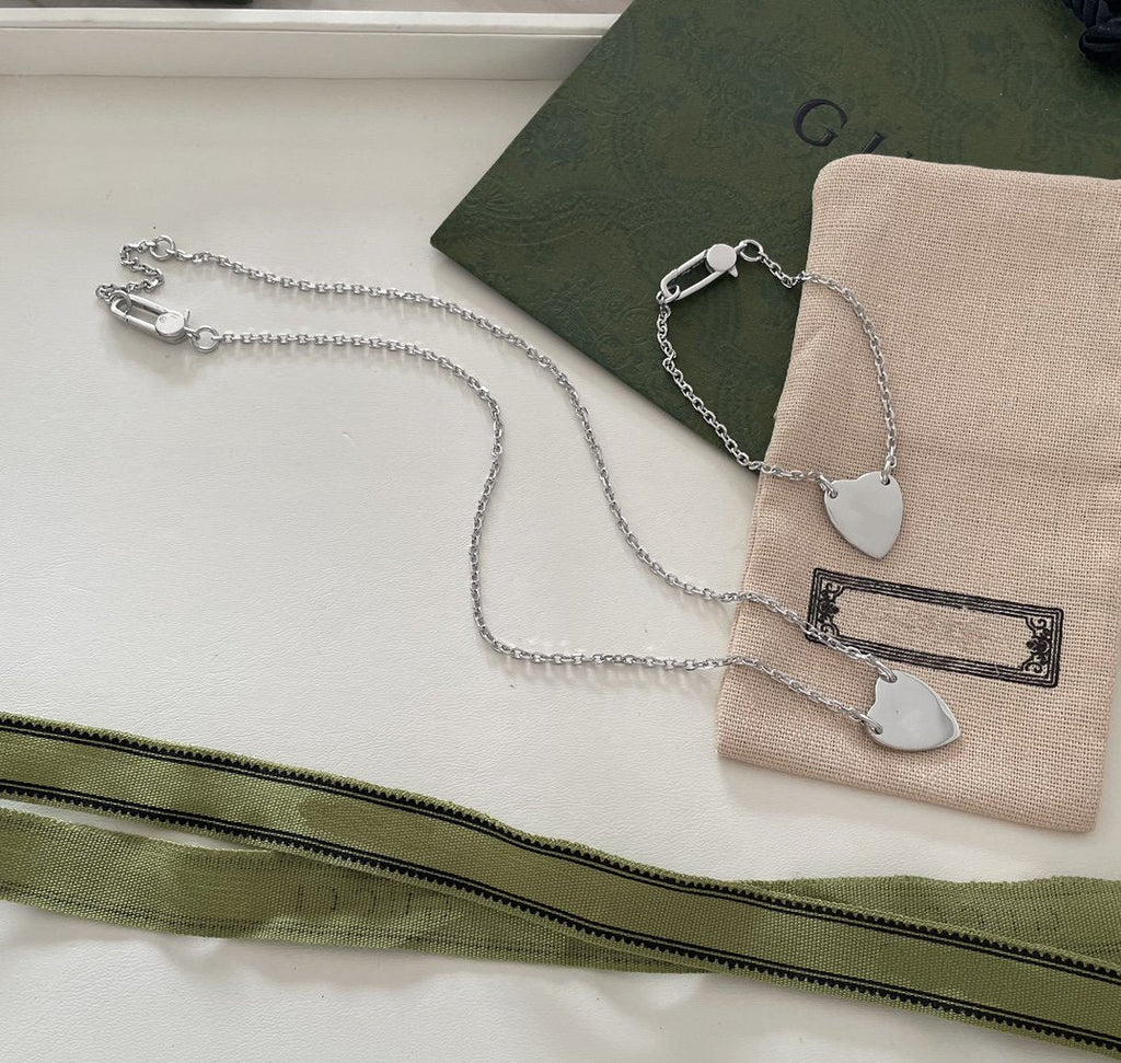 GUCCI LOGO HEART-SHAPED PENDANT SILVER BRACELET