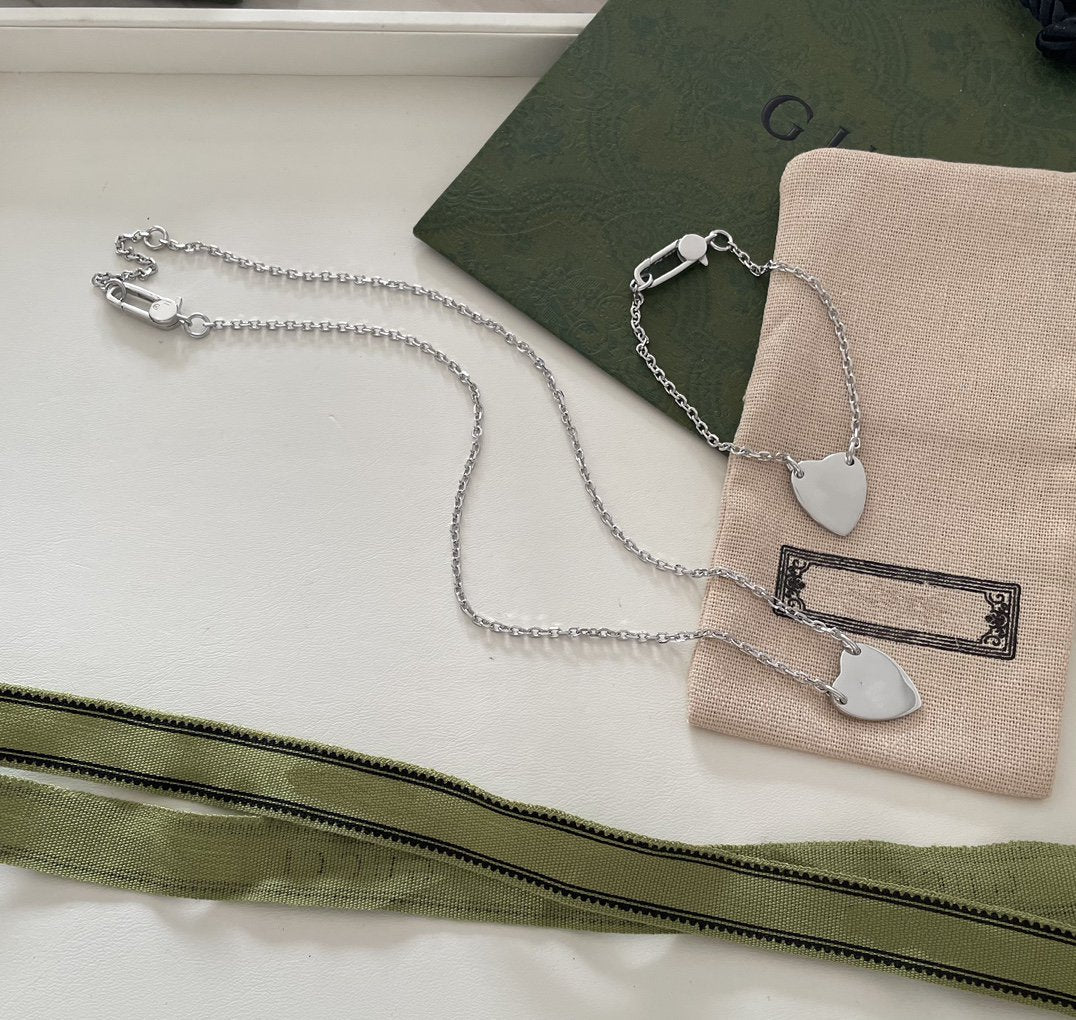 GUCCI LOGO HEART-SHAPED PENDANT SILVER BRACELET