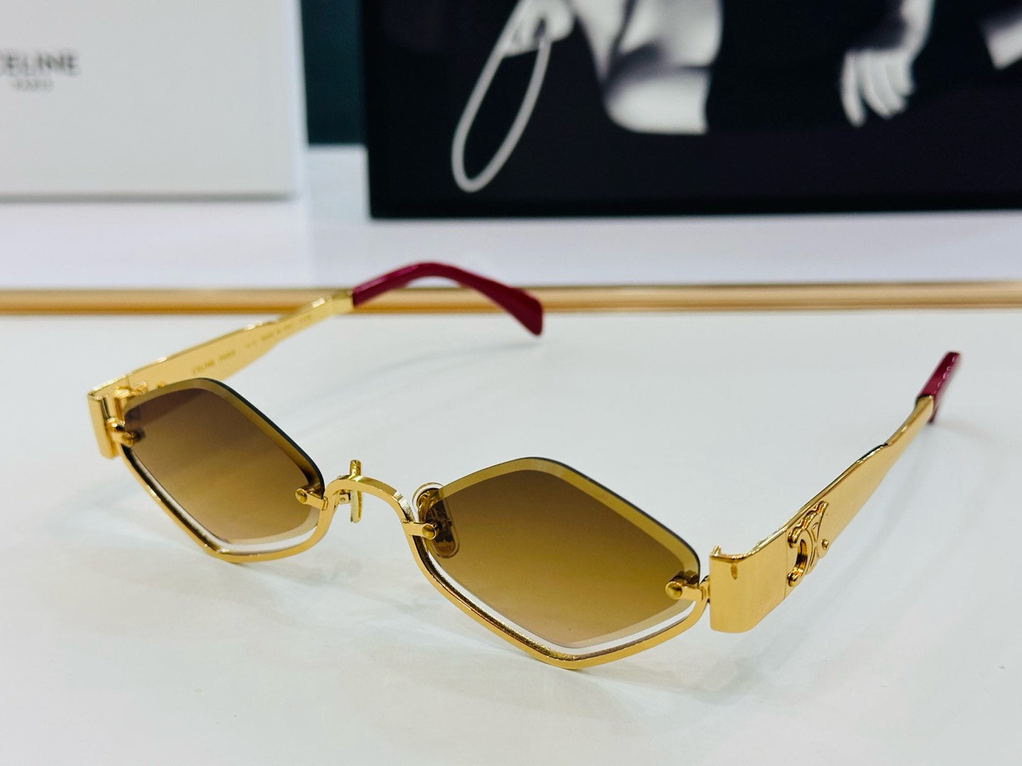 CELINE TRIOMPHE SEMI-RIMLESS SUNGLASS CL42117U IN METAL OCTAGON LENSES