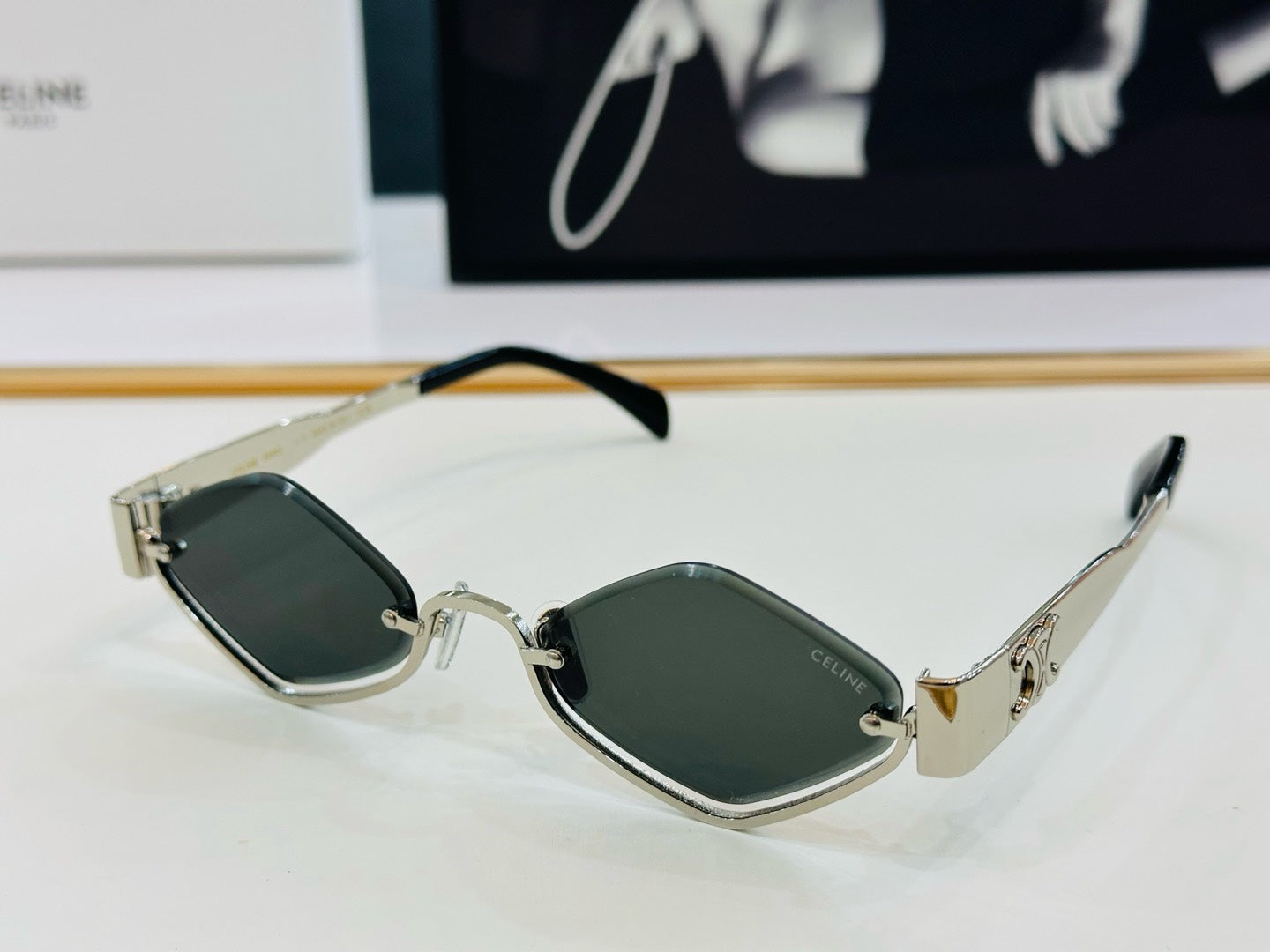 CELINE TRIOMPHE SEMI-RIMLESS SUNGLASS CL42117U IN METAL OCTAGON LENSES
