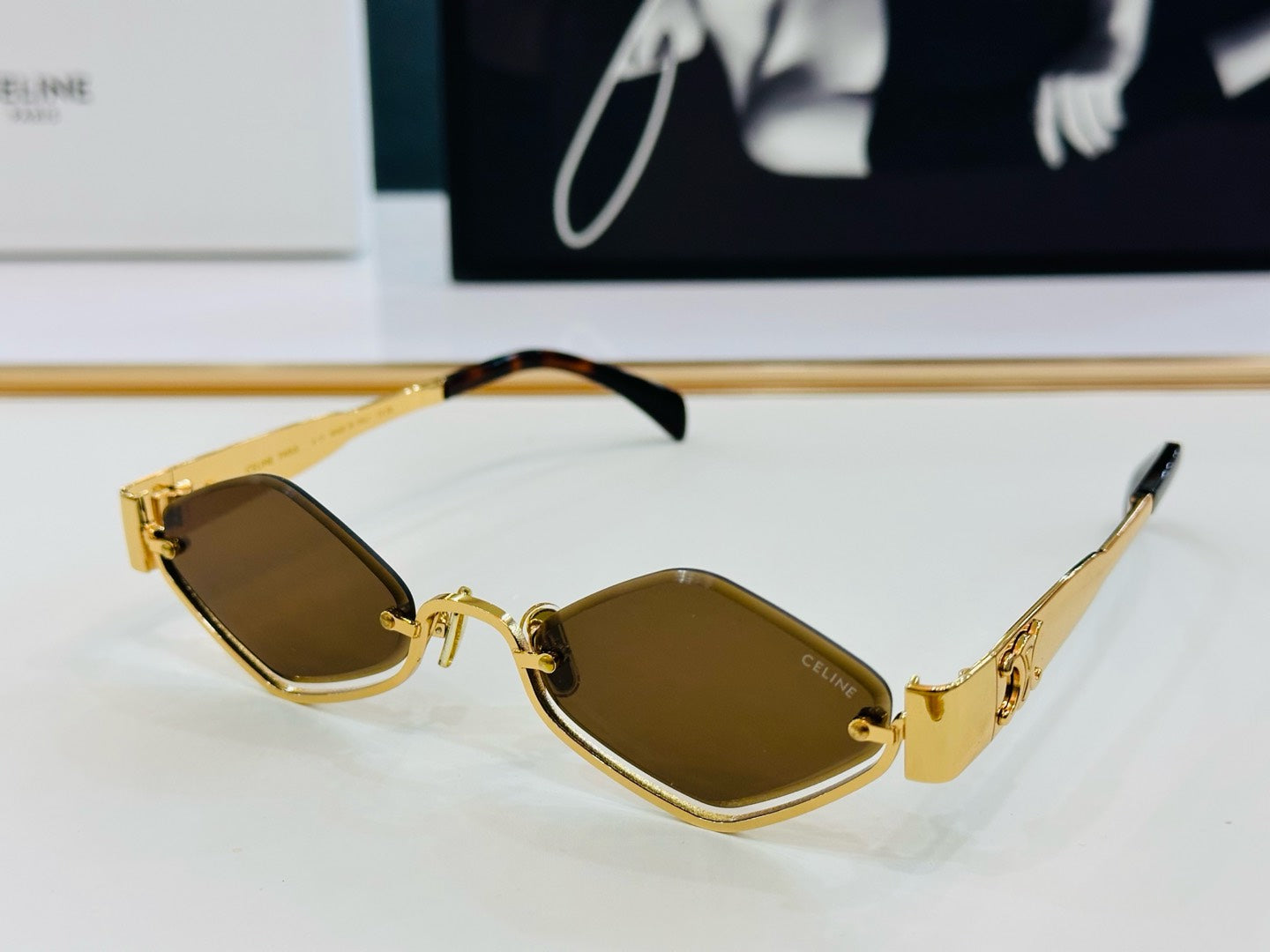 CELINE TRIOMPHE SEMI-RIMLESS SUNGLASS CL42117U IN METAL OCTAGON LENSES