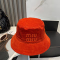 MM BUCKET IN ORANGE VELVET WITH LOGO