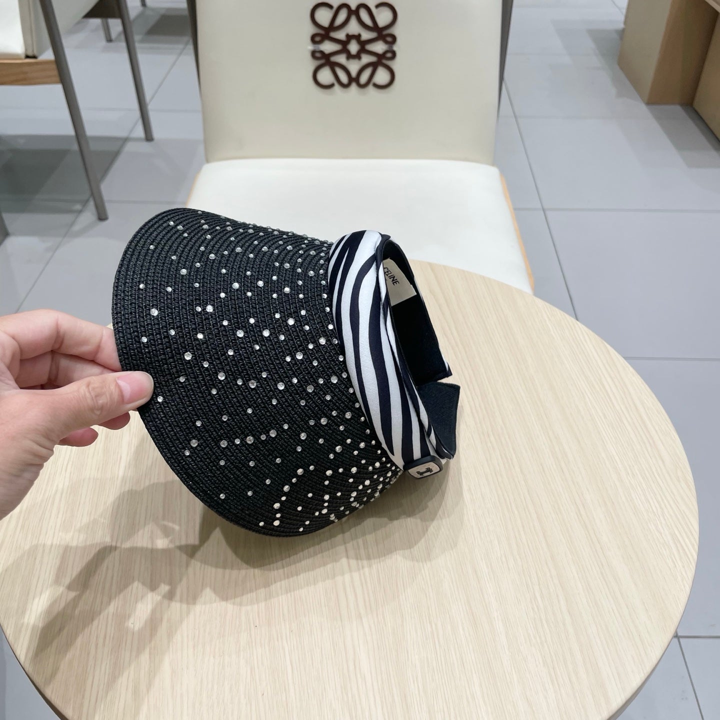 CELINE VISOR HAT MODEL 652215 IN BLACK WOVEN STRAW