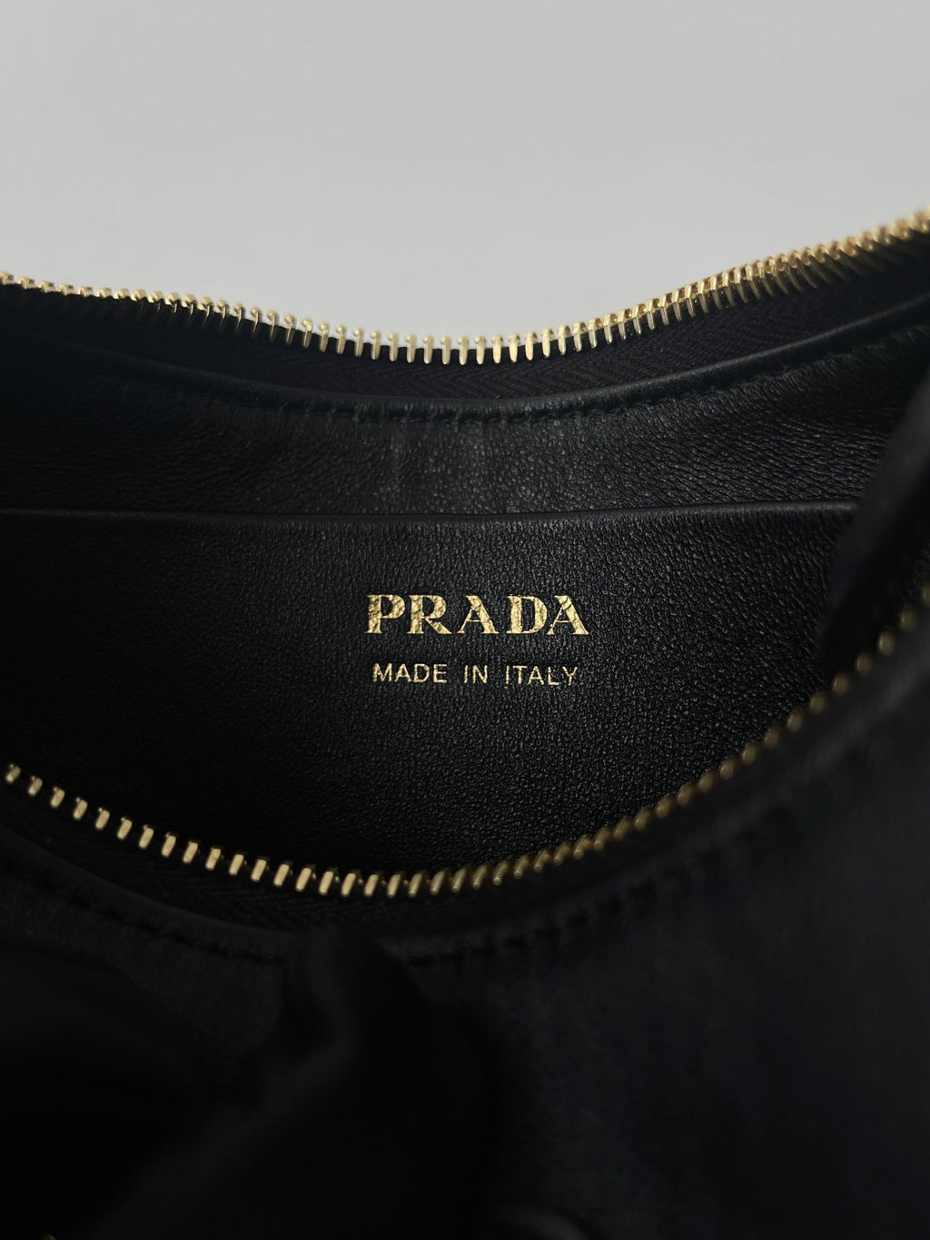 PRADA ARQUÉ 22 SHOULDER BAG IN BLACK LEATHER