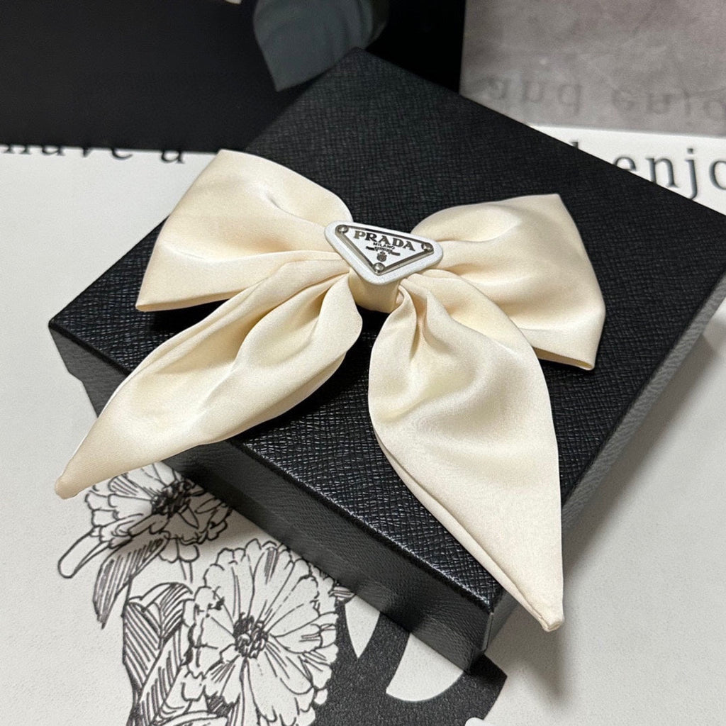 PRADA BOW-KNOT HAIR CLIP IN EGG SHELL SILK 358294