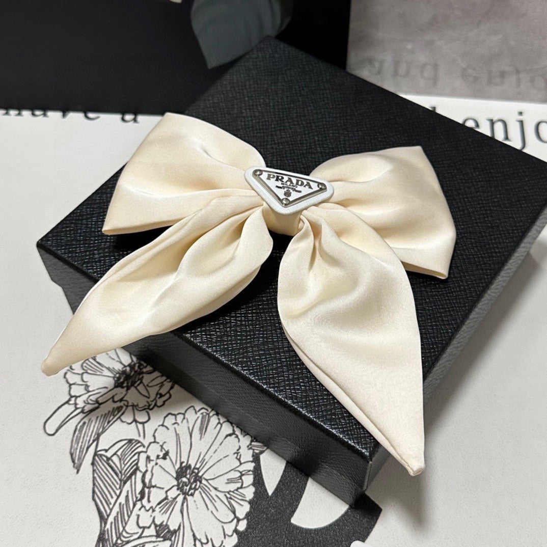 PRADA BOW-KNOT HAIR CLIP IN EGG SHELL SILK 358294