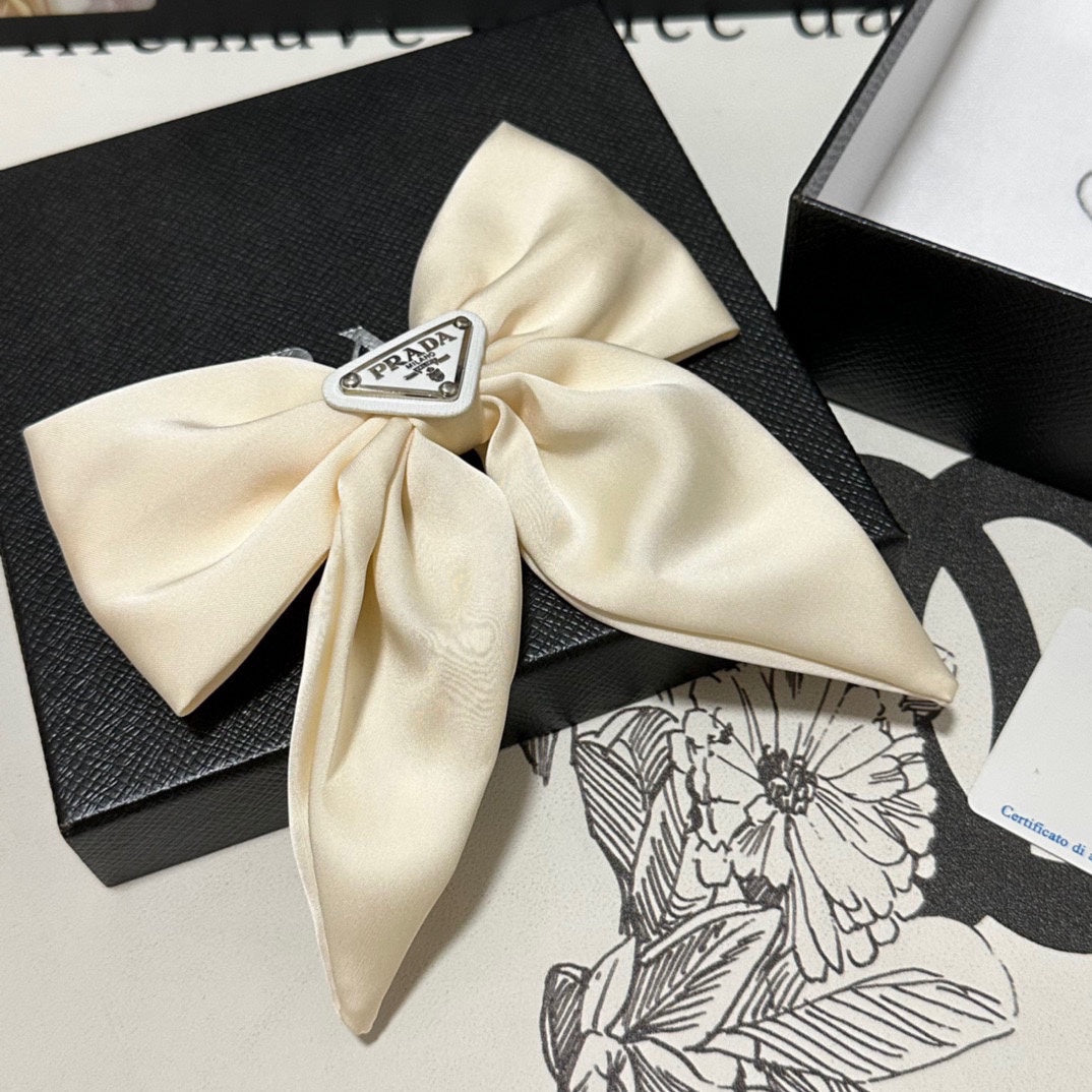 PRADA BOW-KNOT HAIR CLIP IN EGG SHELL SILK 358294