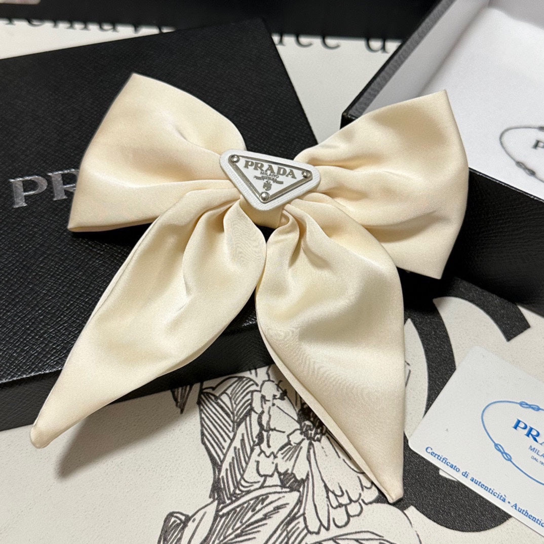 PRADA BOW-KNOT HAIR CLIP IN EGG SHELL SILK 358294