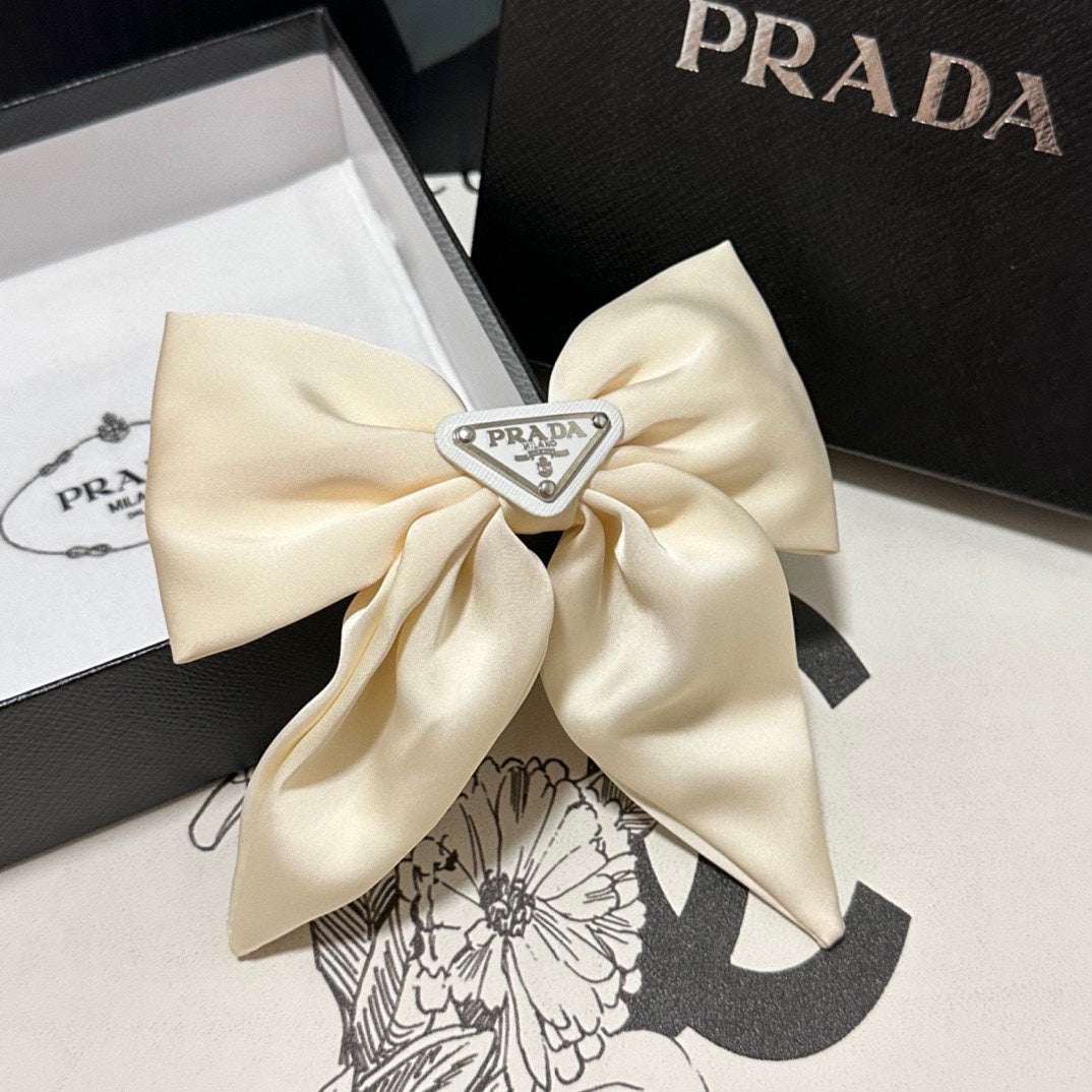 PRADA BOW-KNOT HAIR CLIP IN EGG SHELL SILK 358294