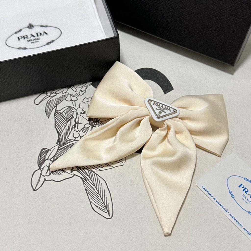 PRADA BOW-KNOT HAIR CLIP IN EGG SHELL SILK 358294