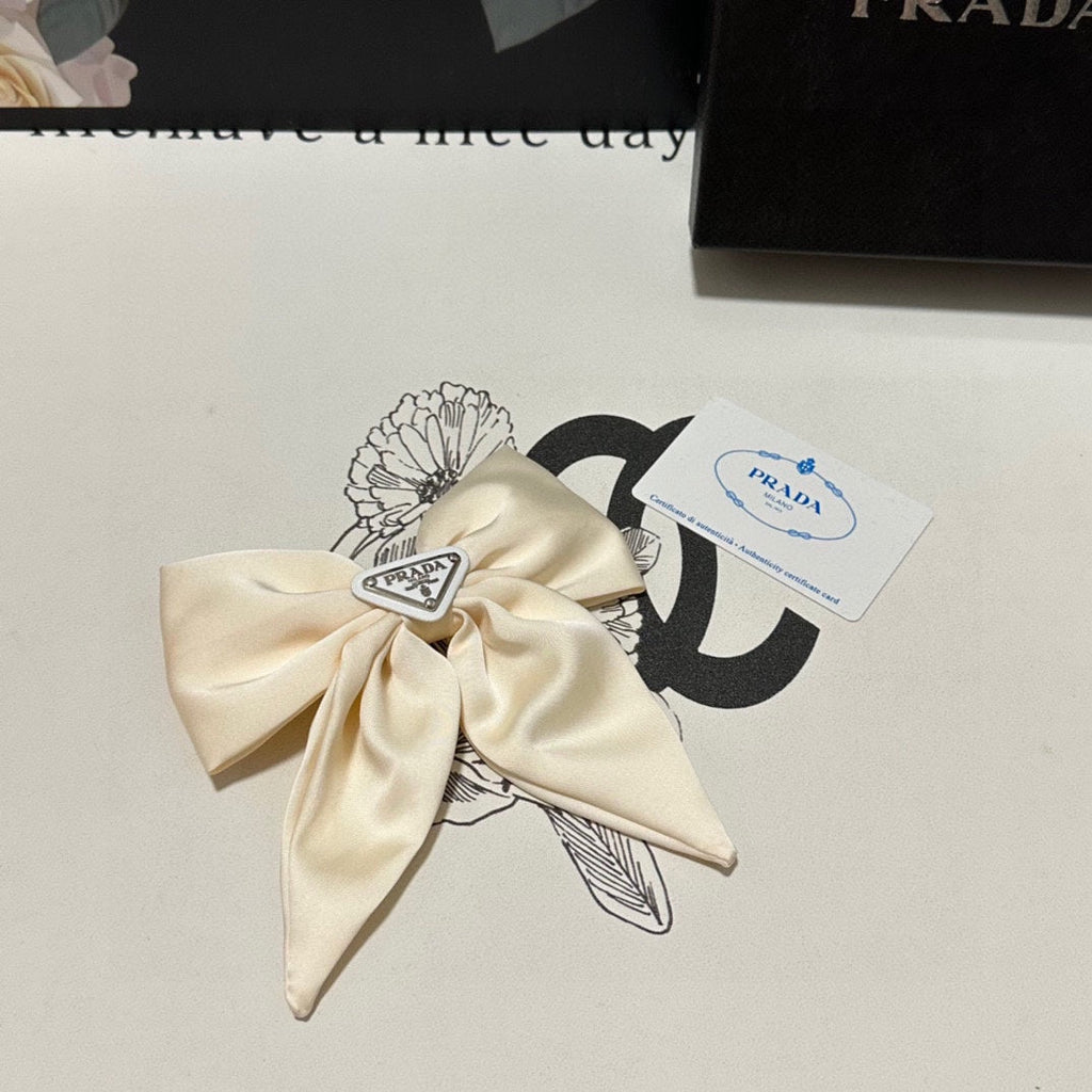 PRADA BOW-KNOT HAIR CLIP IN EGG SHELL SILK 358294