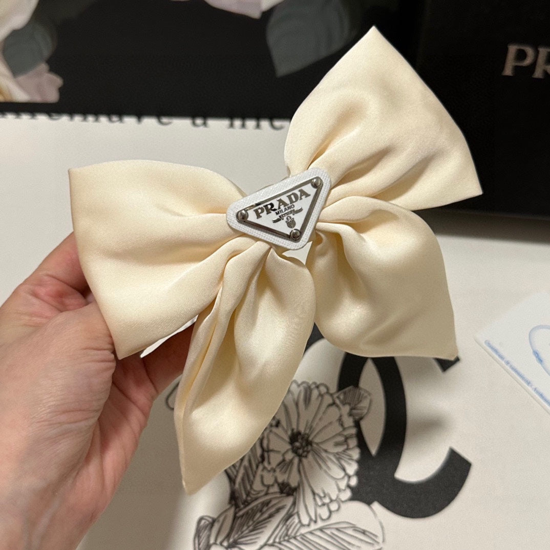 PRADA BOW-KNOT HAIR CLIP IN EGG SHELL SILK 358294