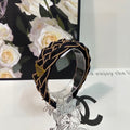 PRADA BRAIDED HEADBAND IN BLACK AND TORTILLA BROWN TRIM FABRIC 381461