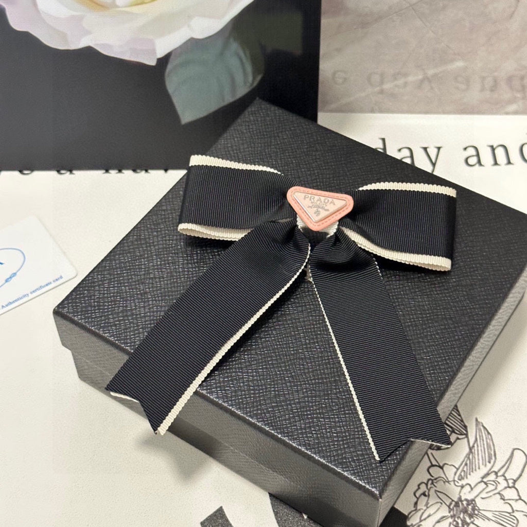 PRADA BOW HAIR CLIP IN BLACK MIX BEIGE FABRIC 406108