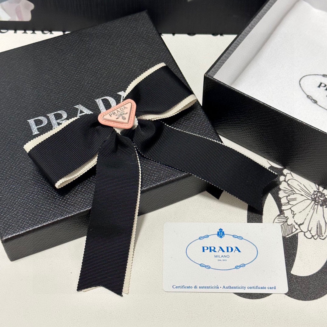 PRADA BOW HAIR CLIP IN BLACK MIX BEIGE FABRIC 406108