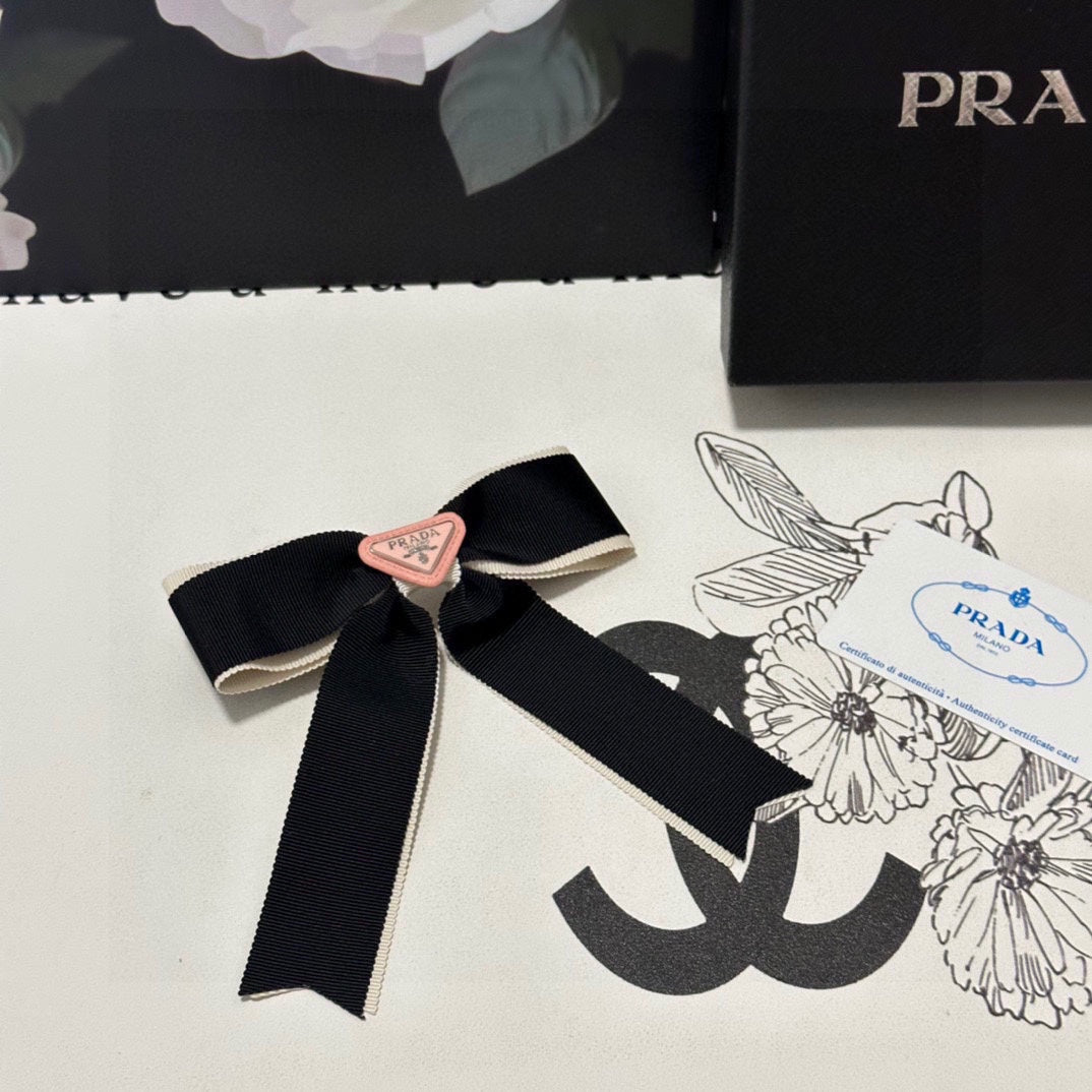 PRADA BOW HAIR CLIP IN BLACK MIX BEIGE FABRIC 406108