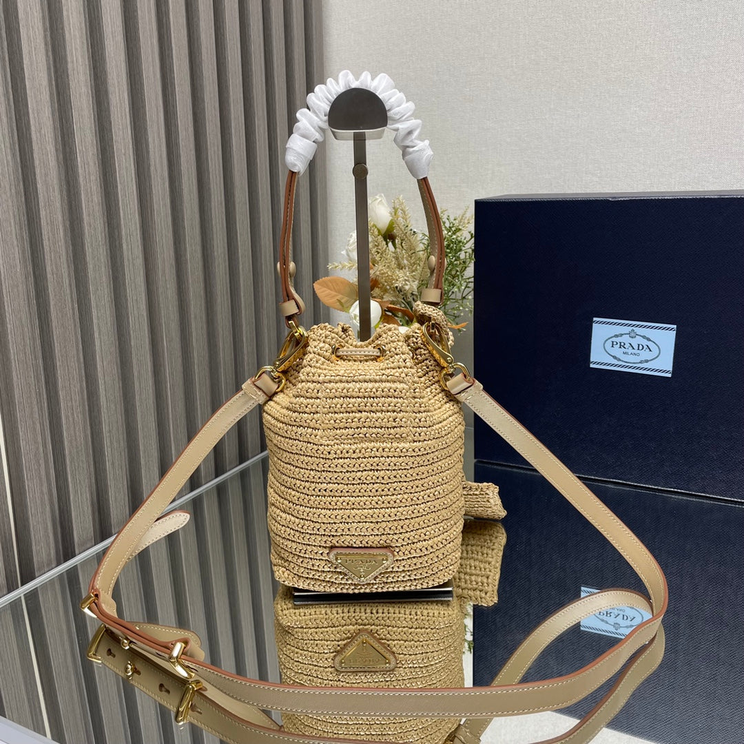 PRADA BUCKET BAG 20 IN BEIGE WOVEN RAFFIA EMBOSSED LOGO
