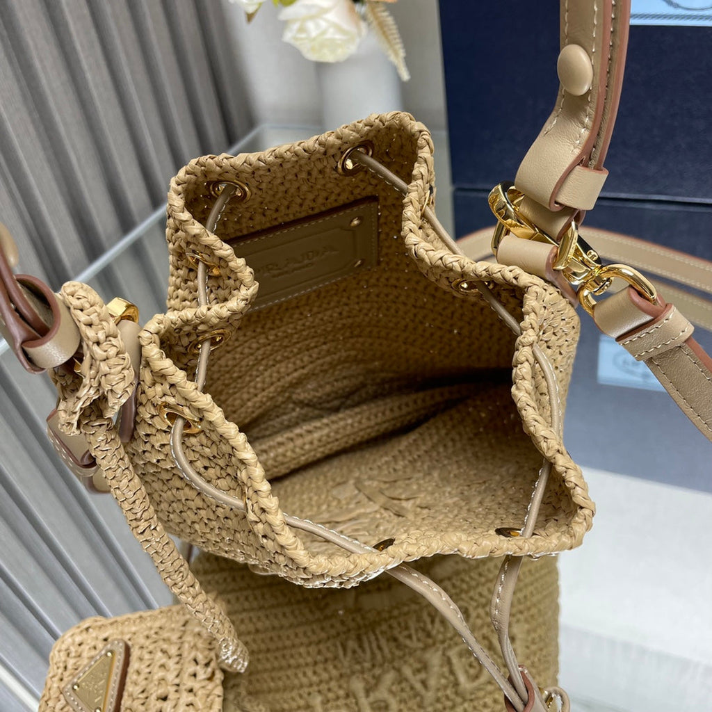PRADA BUCKET BAG 20 IN BEIGE WOVEN RAFFIA EMBOSSED LOGO