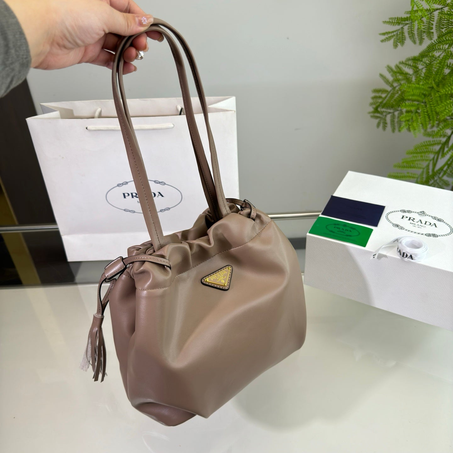 PRADA DRAWSTRING BUCKET BAG 25 IN BROWN BEAR SOFT LAMBSKIN