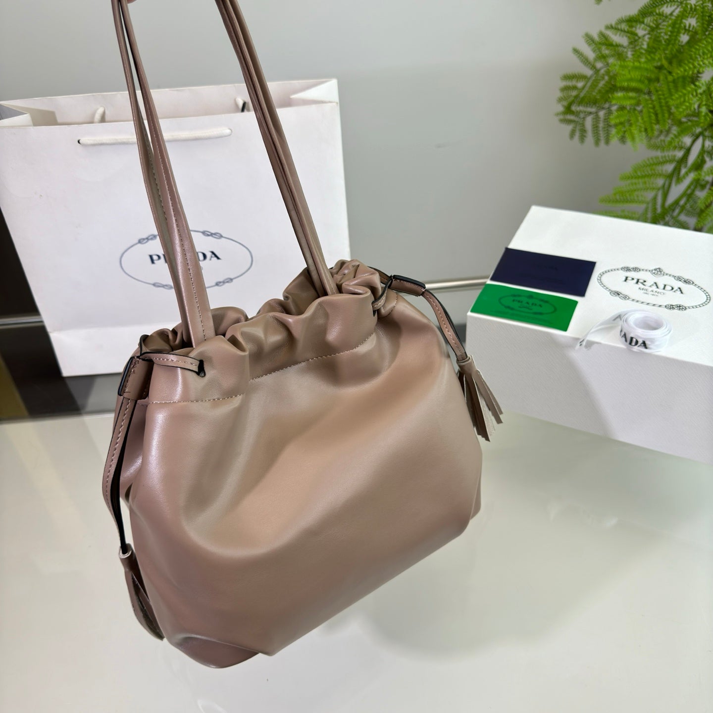 PRADA DRAWSTRING BUCKET BAG 25 IN BROWN BEAR SOFT LAMBSKIN