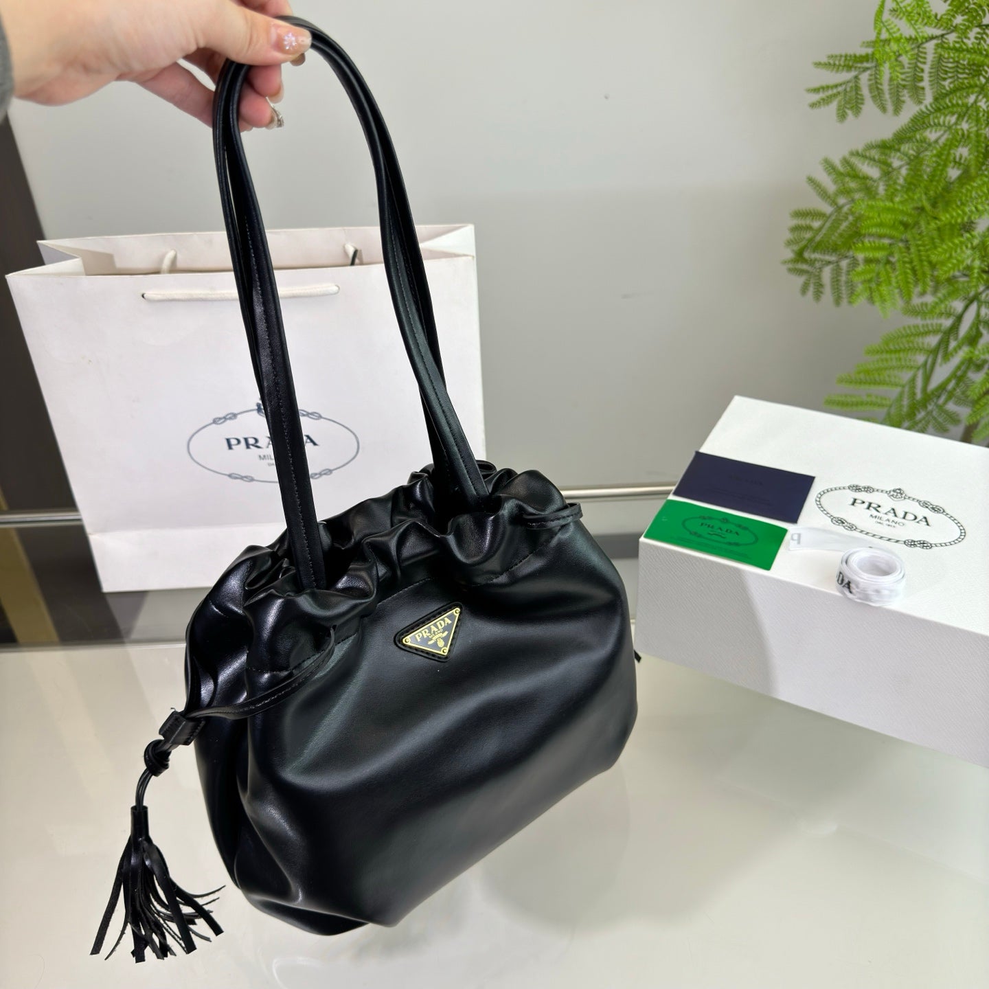 PRADA DRAWSTRING BUCKET BAG 25 IN BLACK SOFT LAMBSKIN