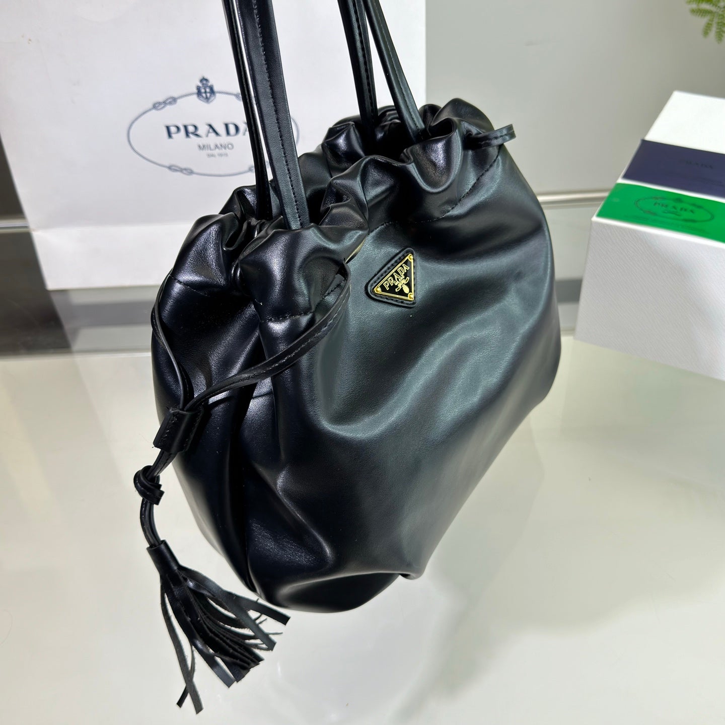 PRADA DRAWSTRING BUCKET BAG 25 IN BLACK SOFT LAMBSKIN