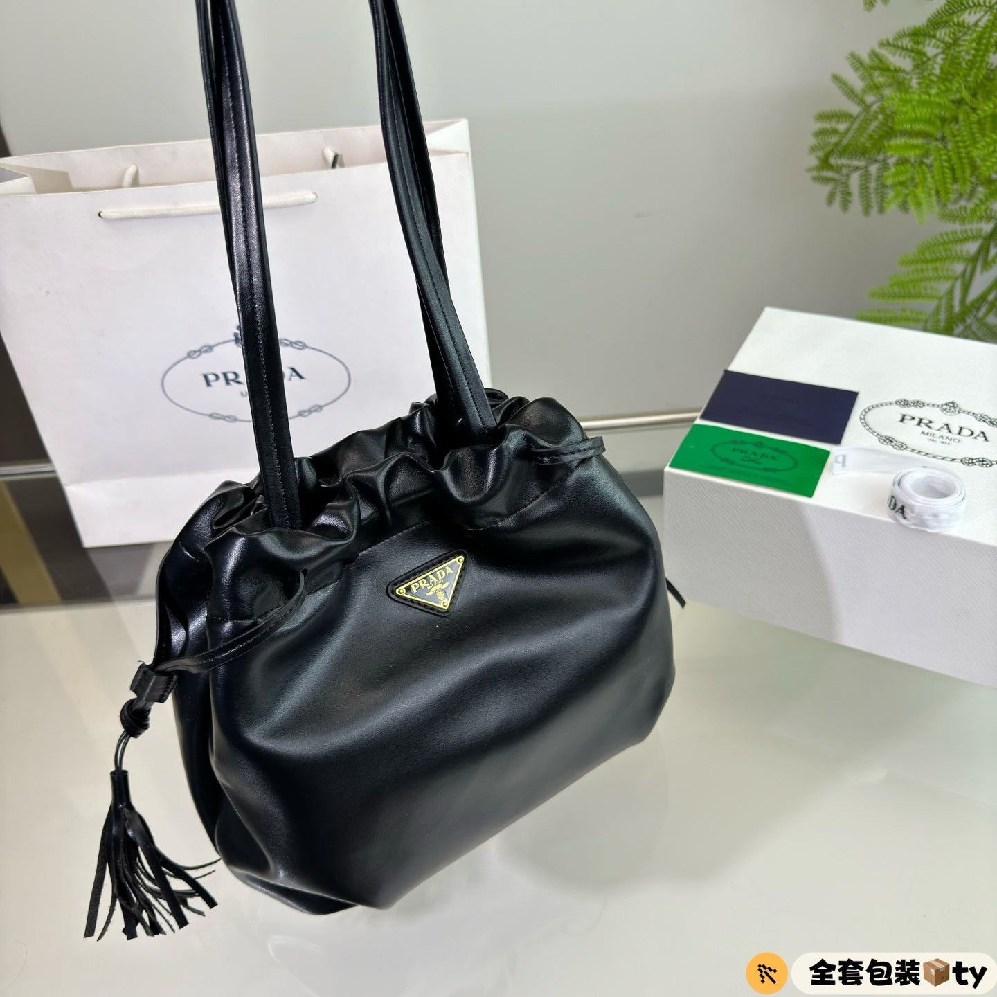 PRADA DRAWSTRING BUCKET BAG 25 IN BLACK SOFT LAMBSKIN