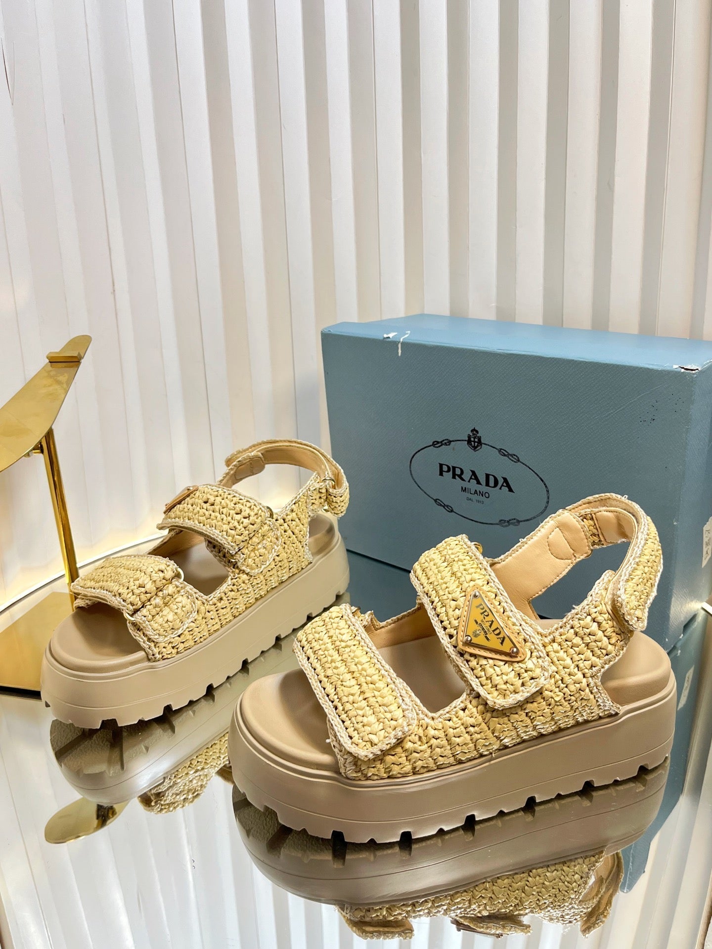 PRADA THICK-SOLED SLIDE IN BEIGE RAFFIA