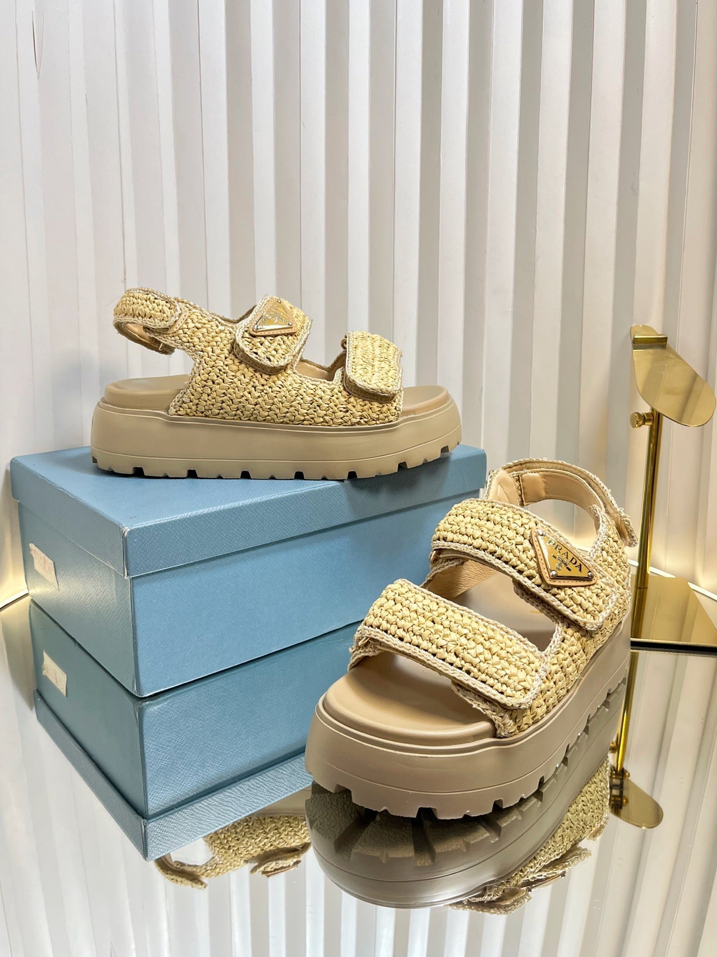 PRADA THICK-SOLED SLIDE IN BEIGE RAFFIA